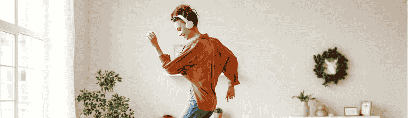 woman dancing with headphones
