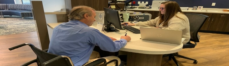 wheelchair user with bank teller