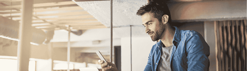 man looking at phone