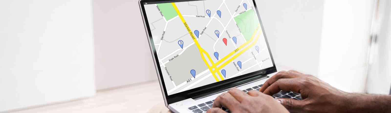 Person looking at a map on a laptop.