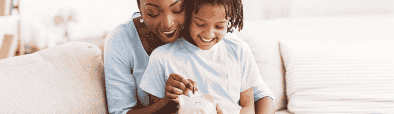 mother and child sitting on couch