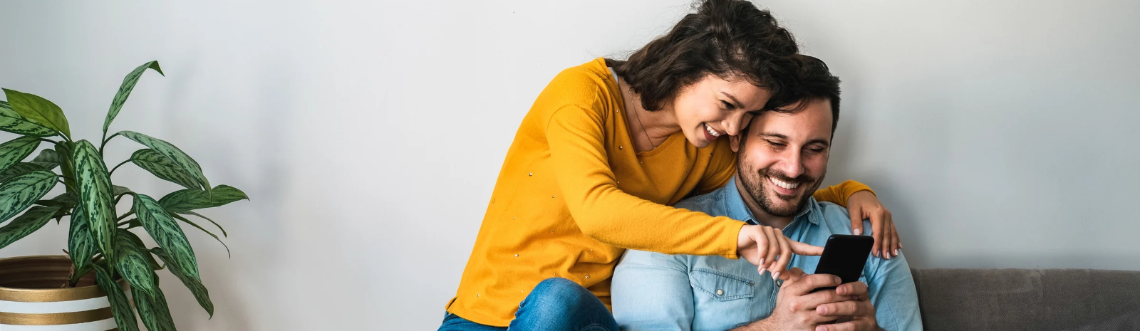 Man and woman looking at phone