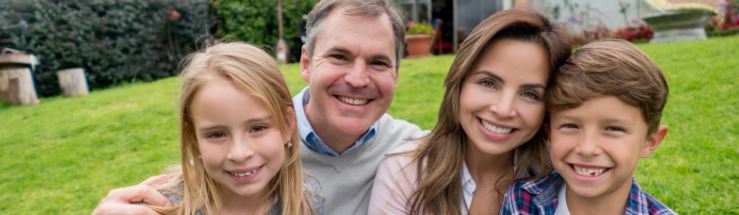 family of four smiling