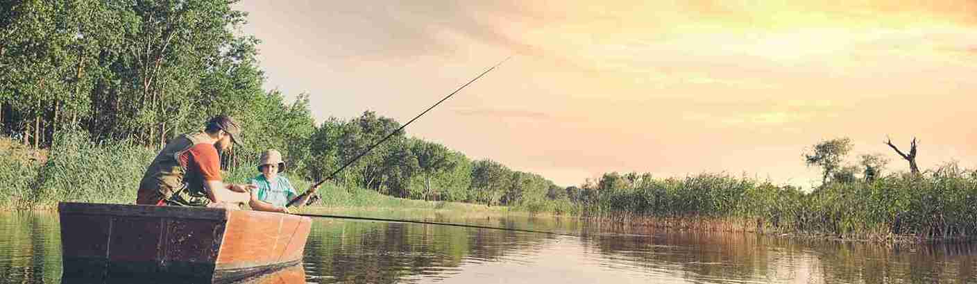 two people fishing in a boat