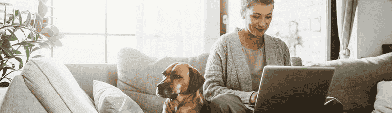 lady on laptop with dog
